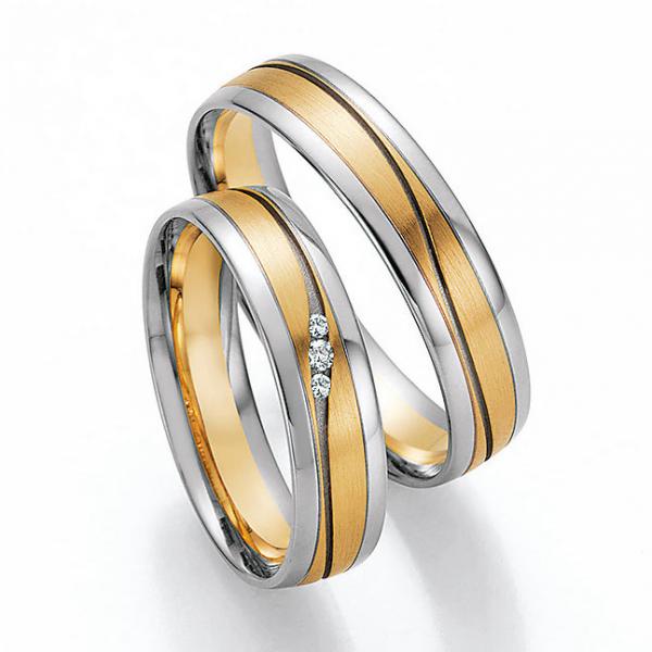 Trauringe Weiss-Gelbgold von Ruesch 66/32050-050